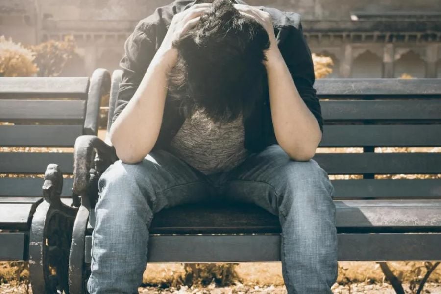 man sitting on bench