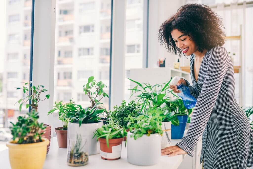 Cropped shot of young woman surrounded by plants