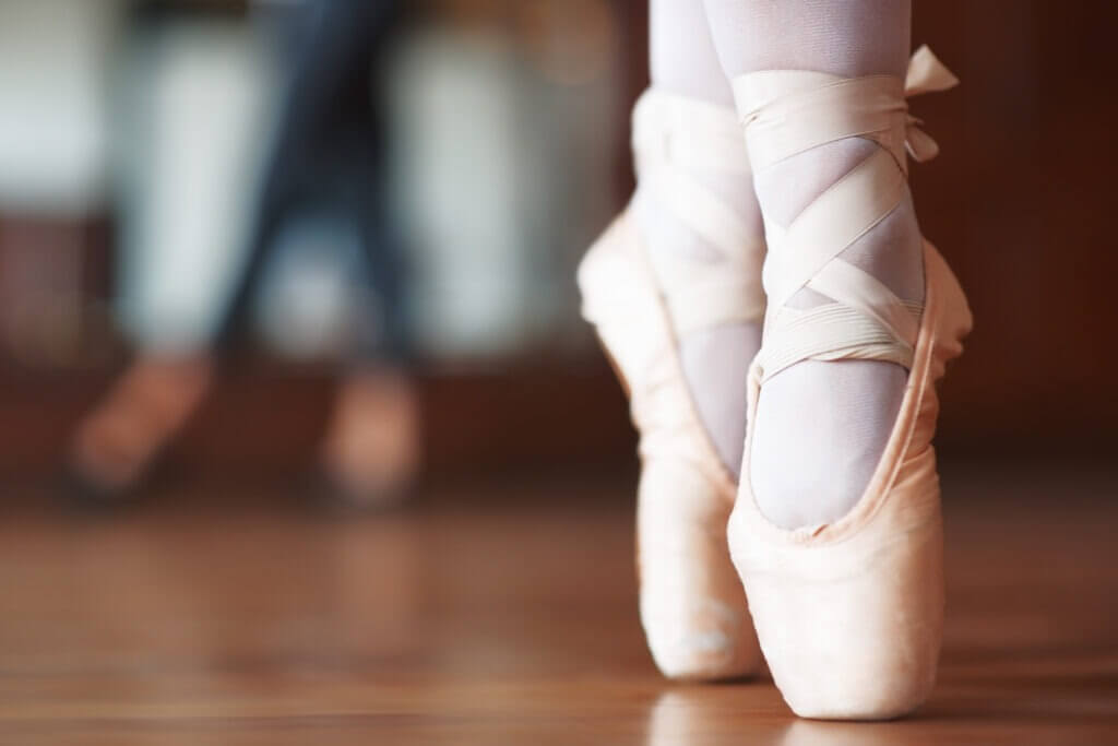 ballet dancer posing in ballet slippers