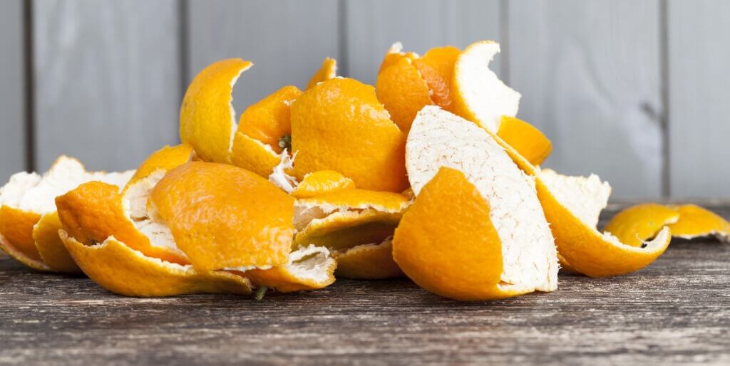 peel from tangerines on a wooden table