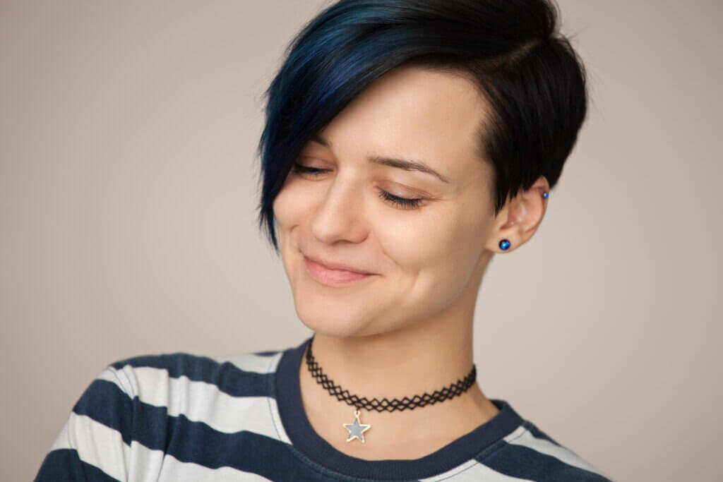 woman in a striped t-shirt on a beige background