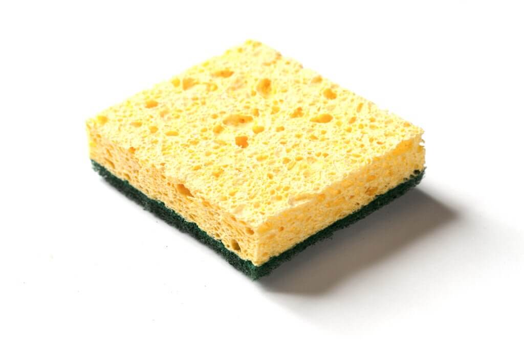 A picture of a sponge used for cleaning dishes.