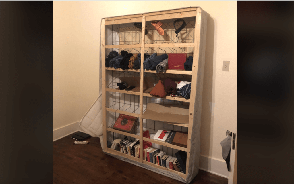 bed frame repurposed as a book shelf from reddit