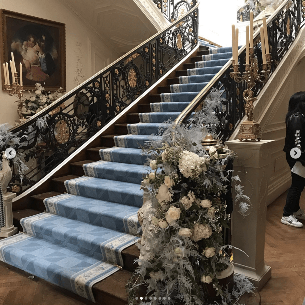 blue carpeted stairs from bridgerton set