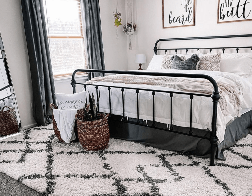 Farmhouse style bedroom with cozy rug under the bed