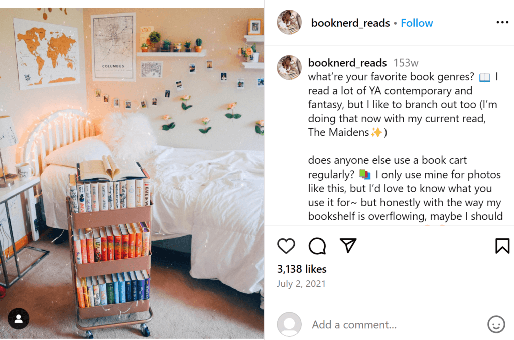 Feminine peach and white themed bedroom with a peach rolling card containing books next to the bed.