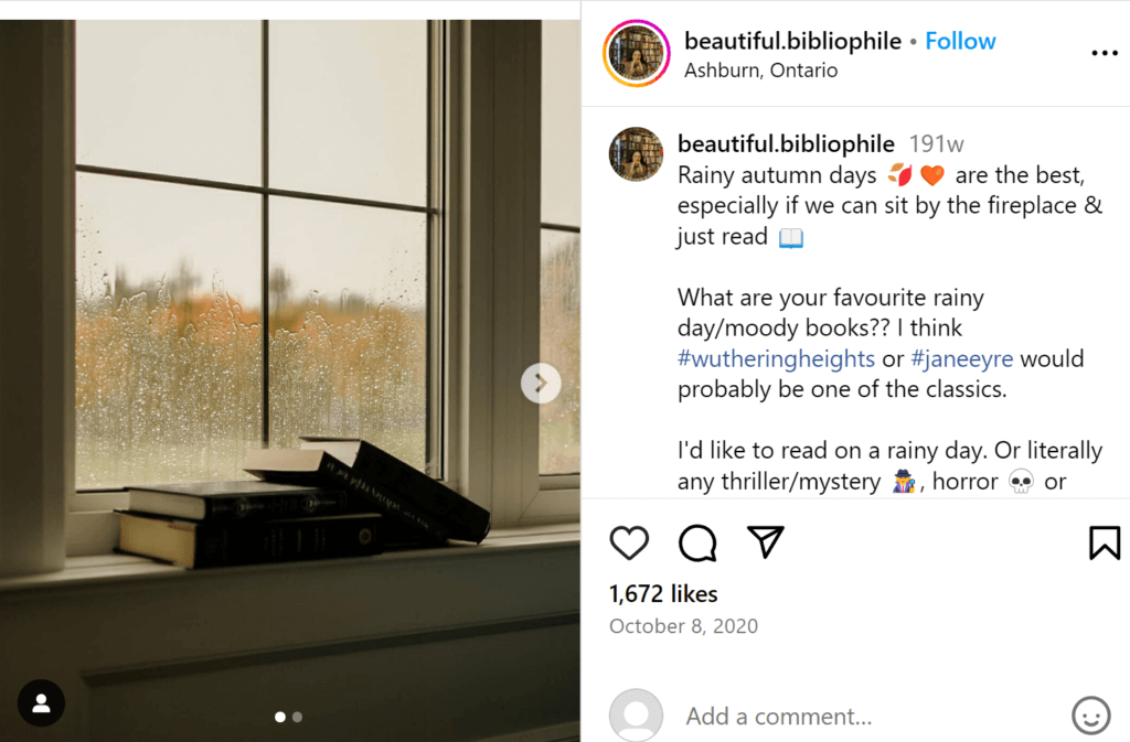 Serene rainy window with several black books loosely arranged on the sill. 