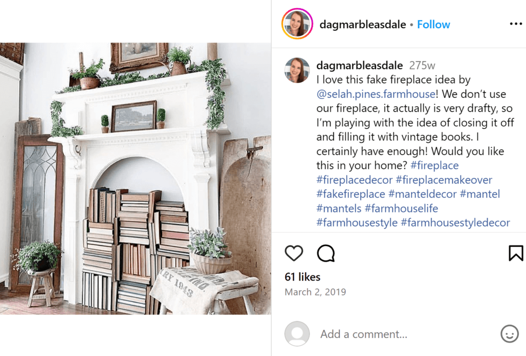 White fake fireplace in a white, muted living room, filled with beige books.