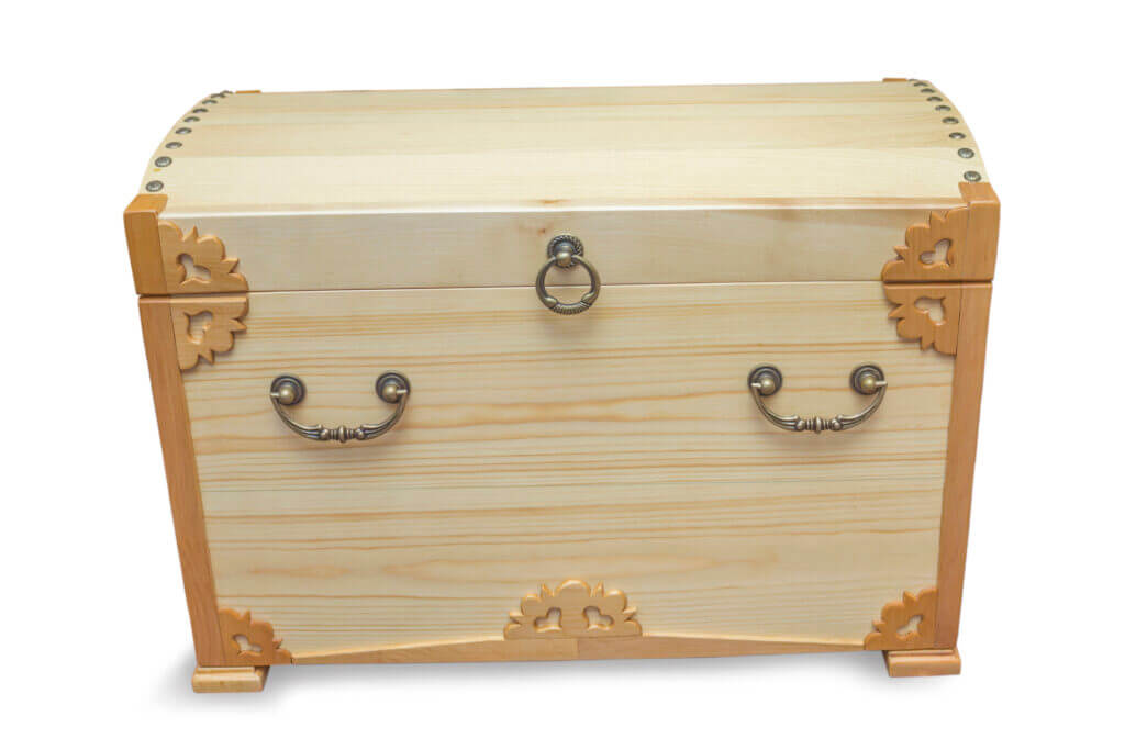 Handmade chest made by craftsman and covered with light varnish on white background