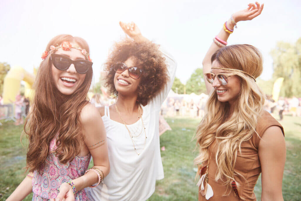 Playful young girls at summer festival