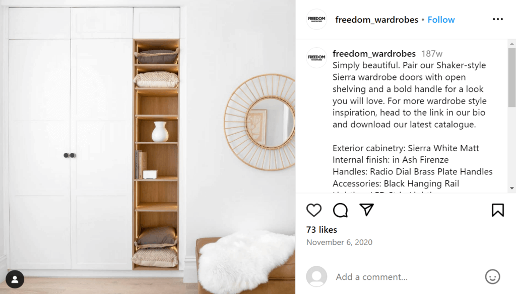 Minimal open cubby shelving next to a closet or pantry in a living room. The shelves are stocked with pillows, a few books, and a vase.