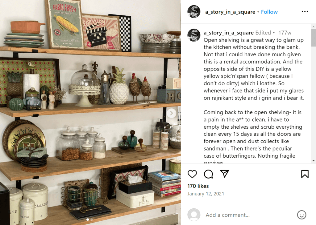 Open shelving on a white wall featuring an eclectic mix of personal belongings, dishes, and trinkets