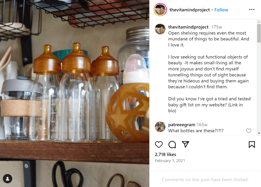 Aesthetically pleasing baby supplies, including multiple identical baby bottles, a sippy cup, and a toy, on open shelving.