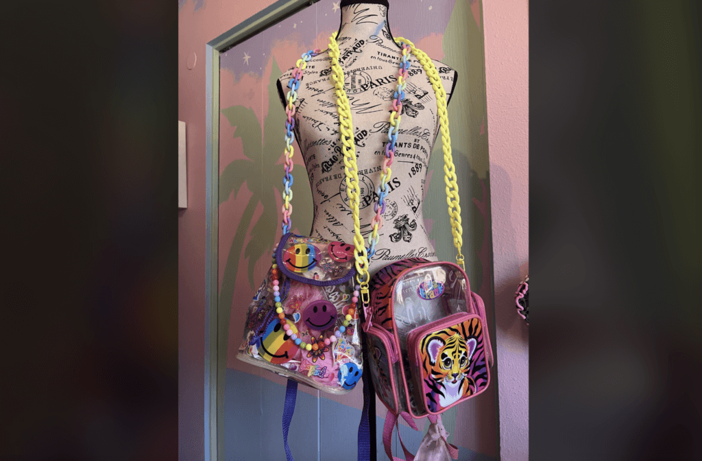 lisa frank backpacks on a manikin