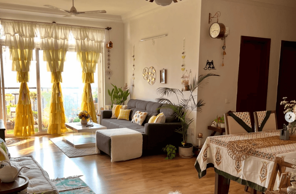 Eclectic living room with ruffled yellow floor-length curtains