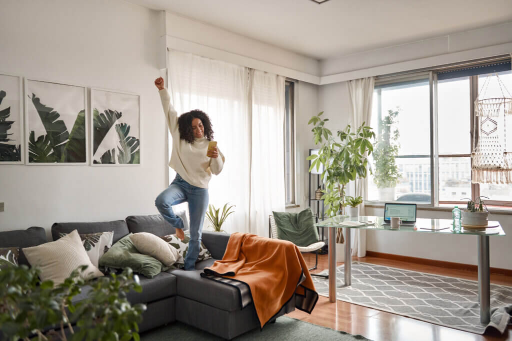 woman dancing alone in living room