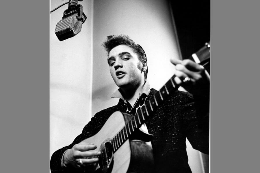 Elvis Presley playing the guitar