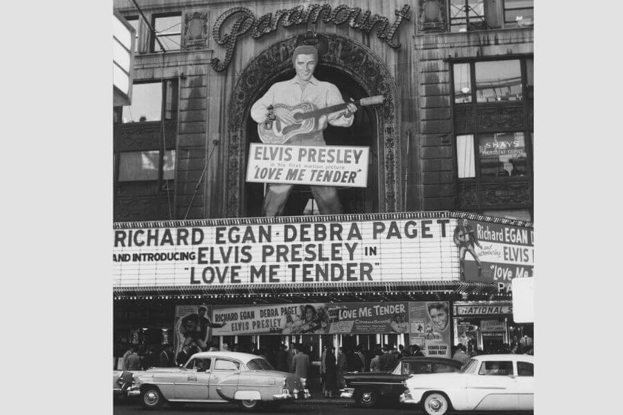 A 1956 cinema theatre with a huge Elvis Presley  human shaped signed on top 