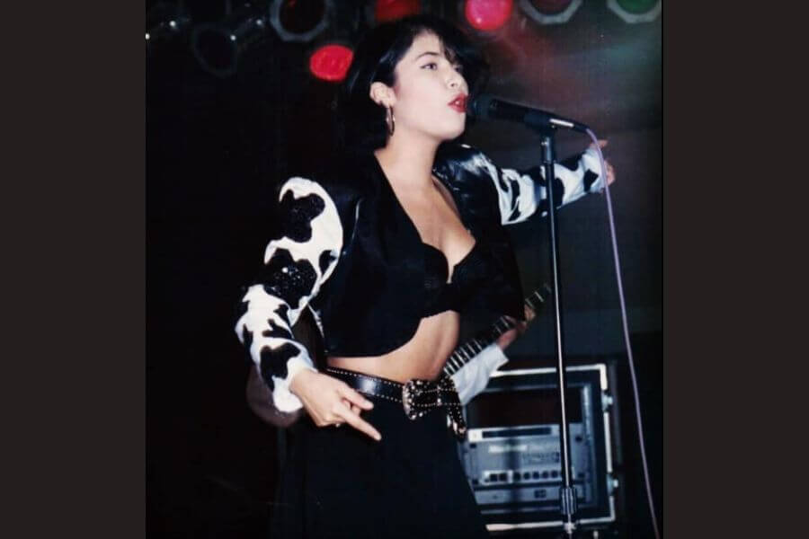 Young selena singing on stage