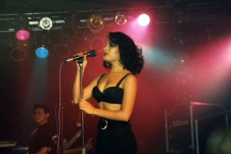 Young selena signing on stage