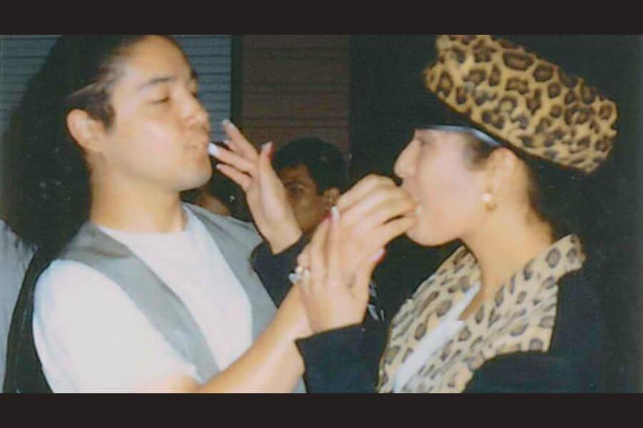 Selena and Chris Perez feeding eachother cake