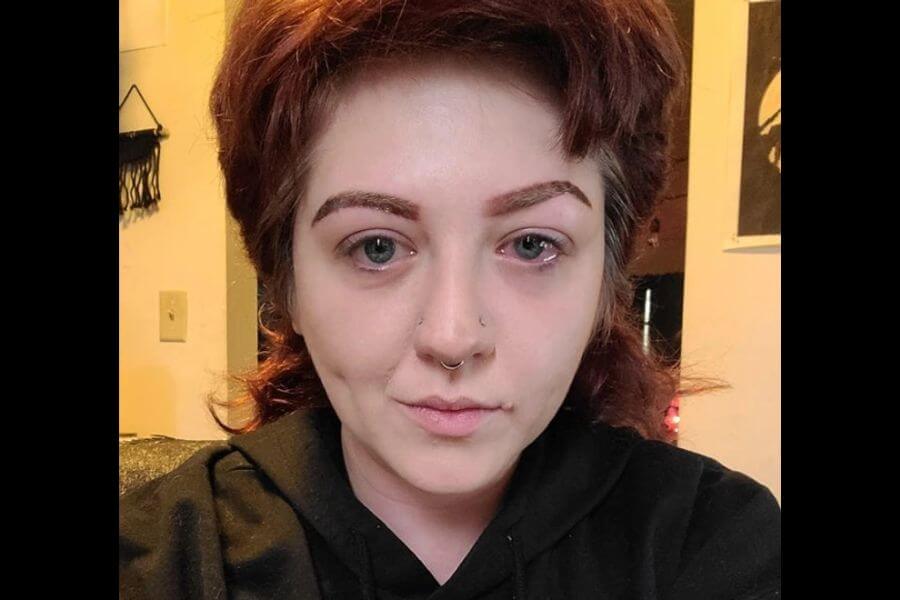 A young pale girl with uneven microbladed eye brows