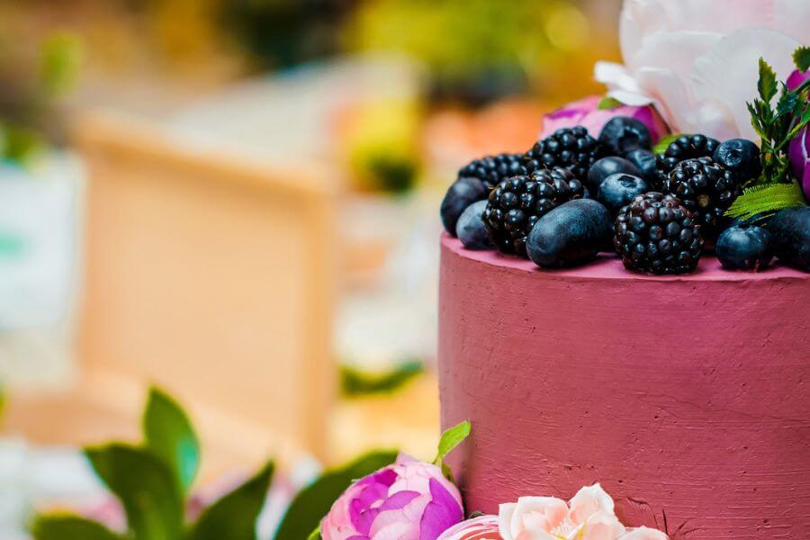 Wedding berry cake and a bouquet of green