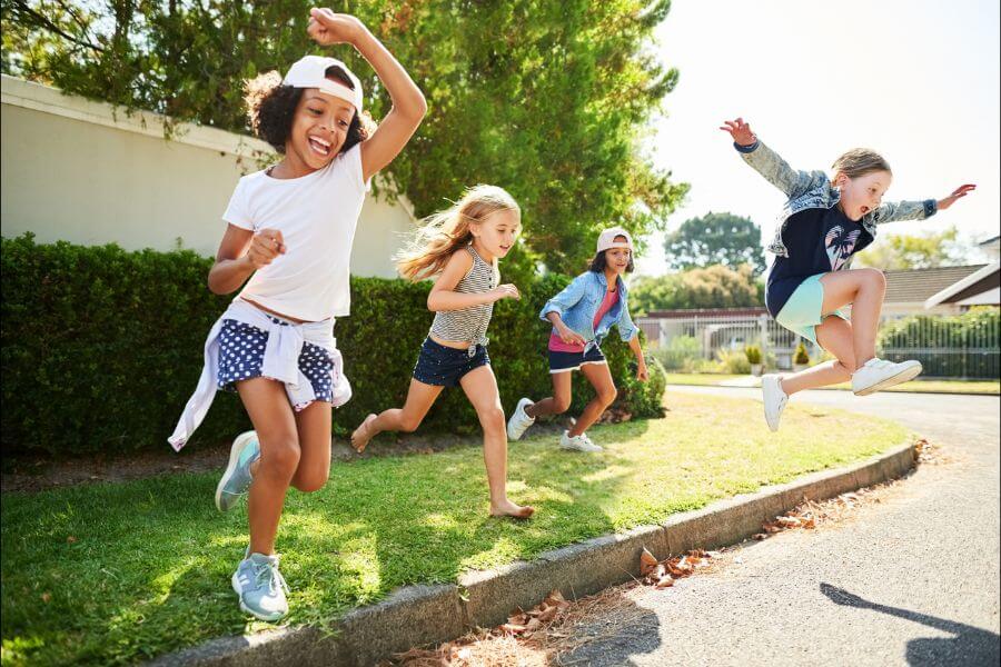 Group of children having fun outdoors on a summer day