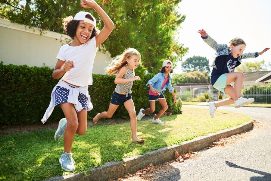 Group of children having fun outdoors on a summer day