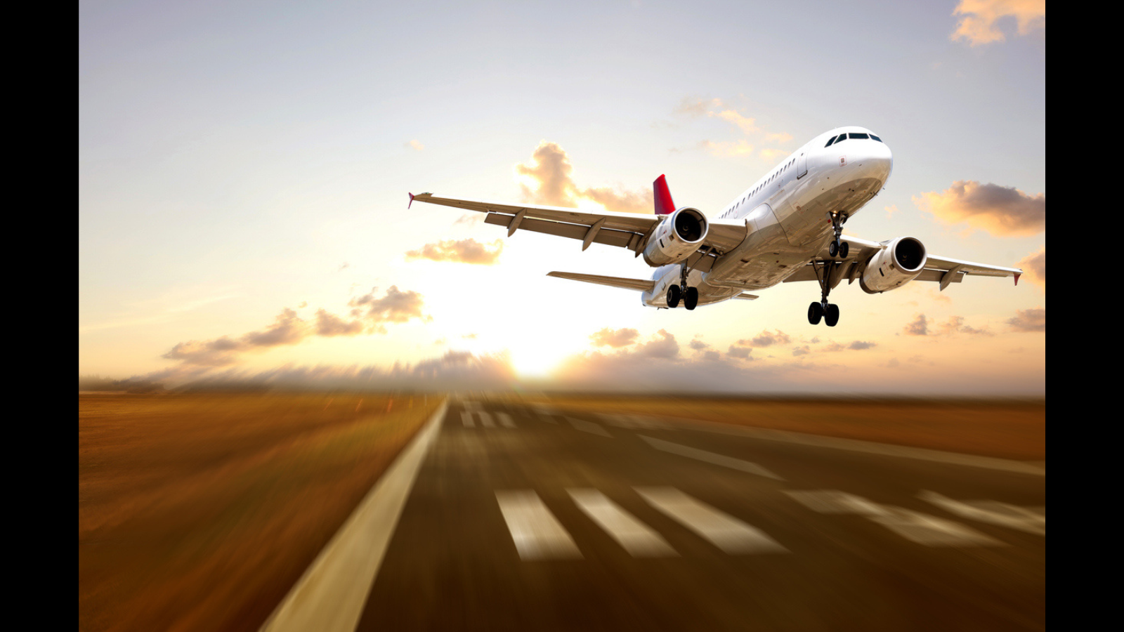 Airplane flying from the runway at a high speed. 