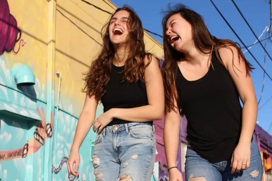 two young girls laughing 