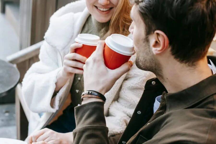 close up of a young couple drinking coffee