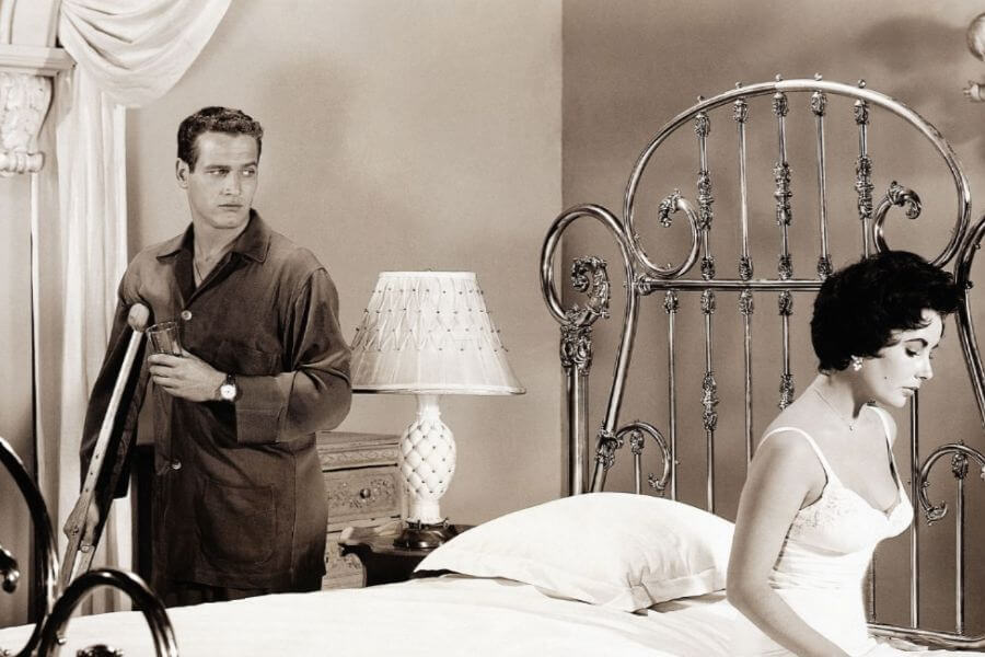 Paul Newman and Elizabeth Taylor in the 1958 film adaptation of Tennessee Williams' CAT ON A HOT TIN ROOF (1958).