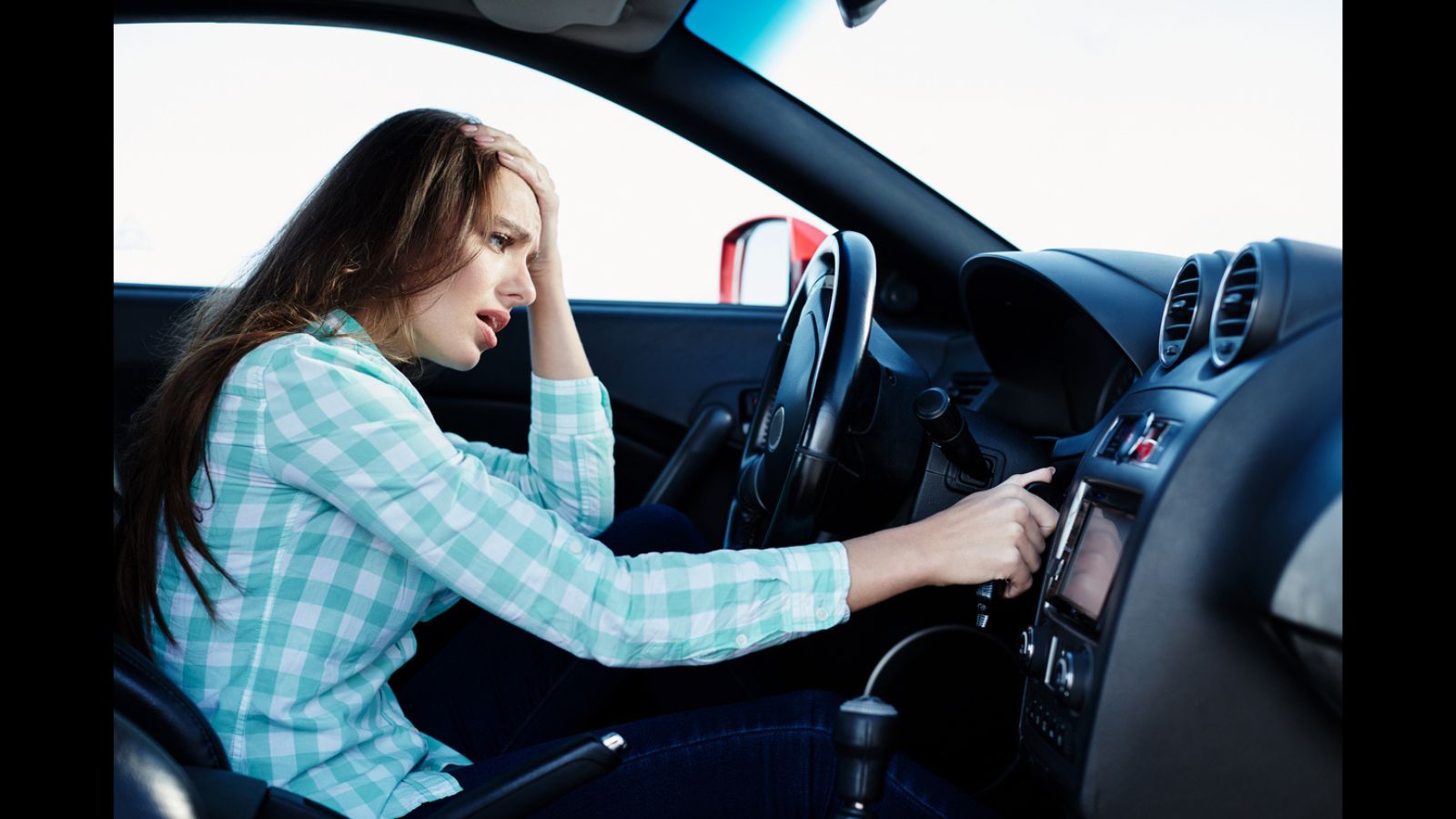 A woman on her car, angry.