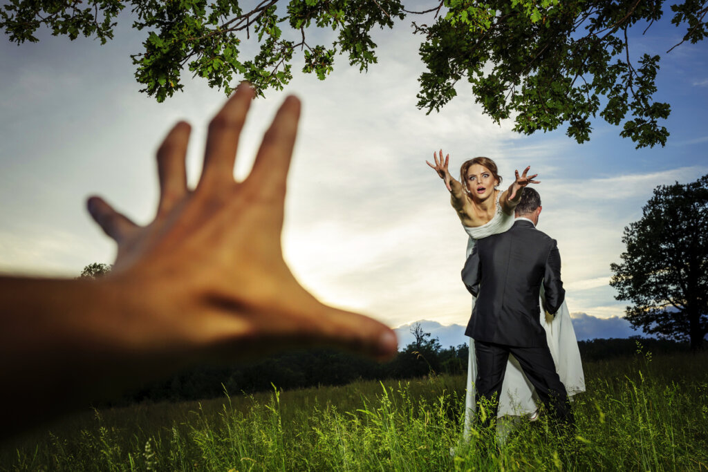 bride stollen by groom and man hand grabbing her.