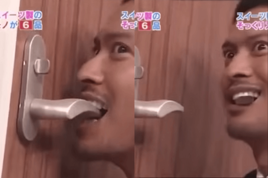 The image shows a contestant on a Japanese game show attempting to determine if a door handle is real or made of candy by licking it. With a mix of curiosity and excitement, the contestant tries to figure out if everyday objects are edible, showcasing the quirky and humorous premise of the game.