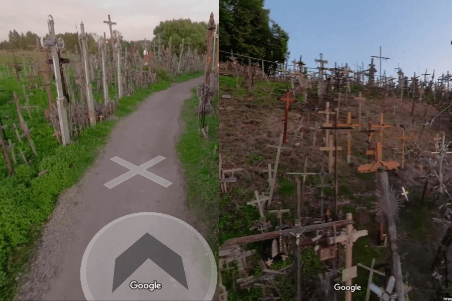 This image shows a pathway lined with numerous crosses of varying sizes and styles, leading through a hillside densely covered in more crosses. The scene resembles the Hill of Crosses in Lithuania, creating a solemn and atmospheric view filled with religious symbols against a green, natural landscape.