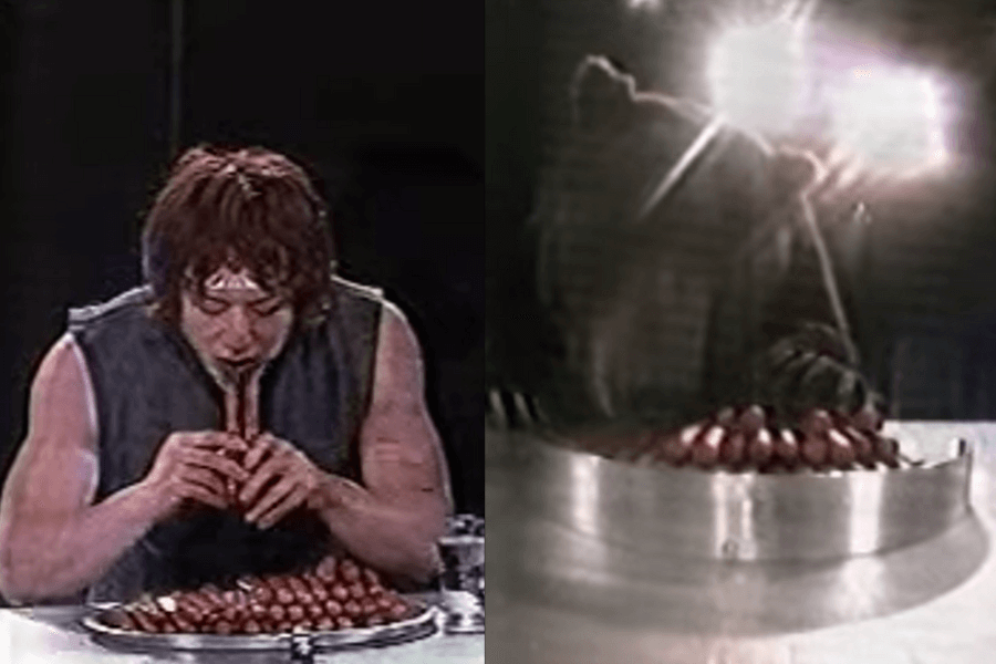 The image shows a contestant competing in a sausage-eating challenge, facing off against an actual bear as his opponent. Both the contestant and the bear have a tray of sausages, creating a bizarre yet humorous showdown that tests human speed against animal instinct. This setup blends comedy with suspense, making it a truly unique and unforgettable game show moment.