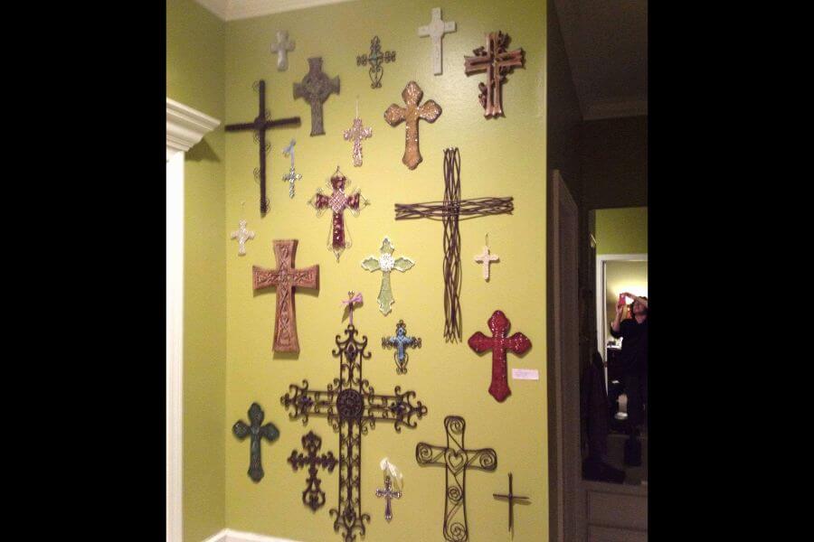 green wall full of crosses