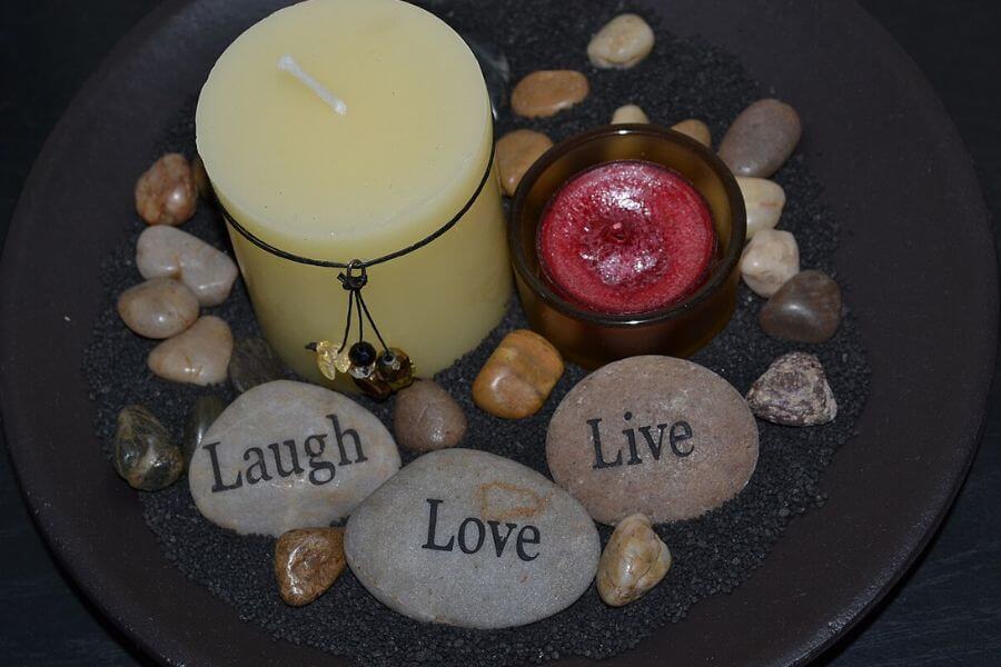 rocks with live laugh love inscription