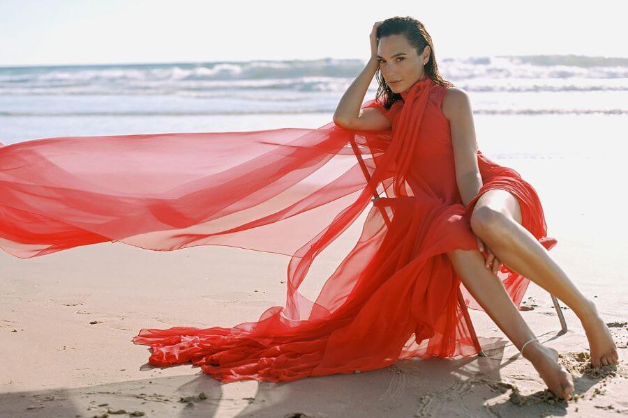 Gal Gadot at the beach wearing a red dress