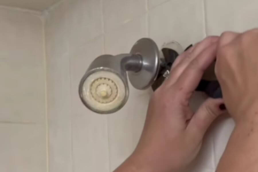 hand reparing showerhead