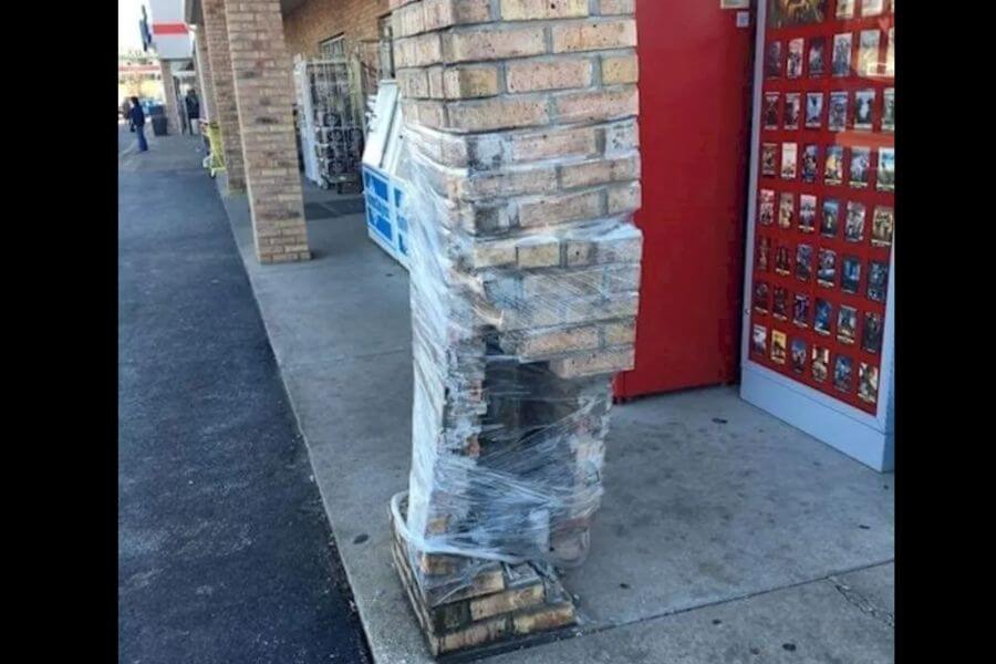 broken brick collumn wrapped in paper foil