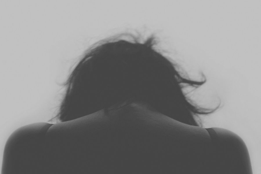 black and white picture of the back of a woman's head