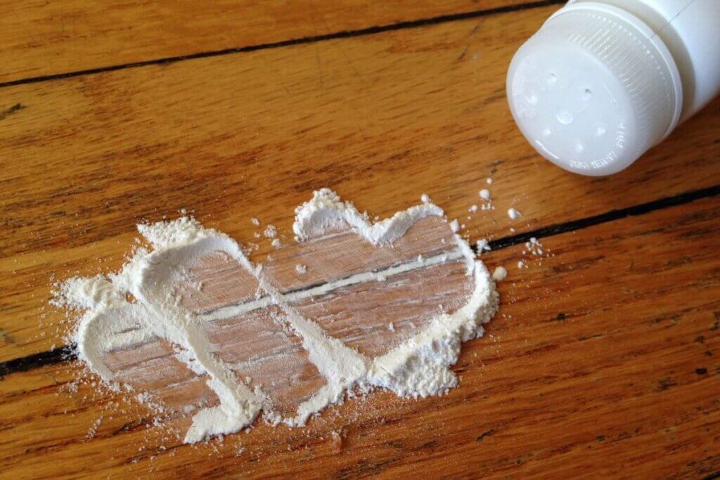 white powder over wooden board