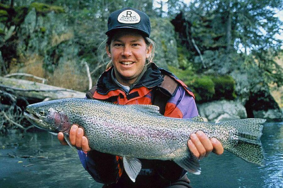 smiling man holding a fish