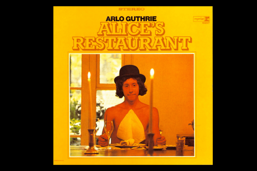 The album cover for Alice's Restaurant by Arlo Guthrie shows him seated at a dinner table with a playful expression, wearing a top hat and holding a glass, framed by a yellow background.