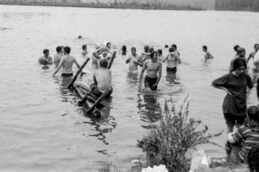 young peoplr bathing in the river