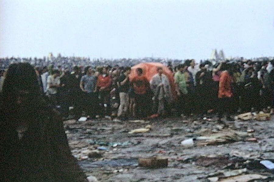 trash on muddy floor on an outdoor festival