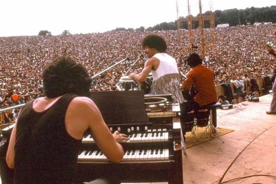 Santana playing in front of a gigantic crowd